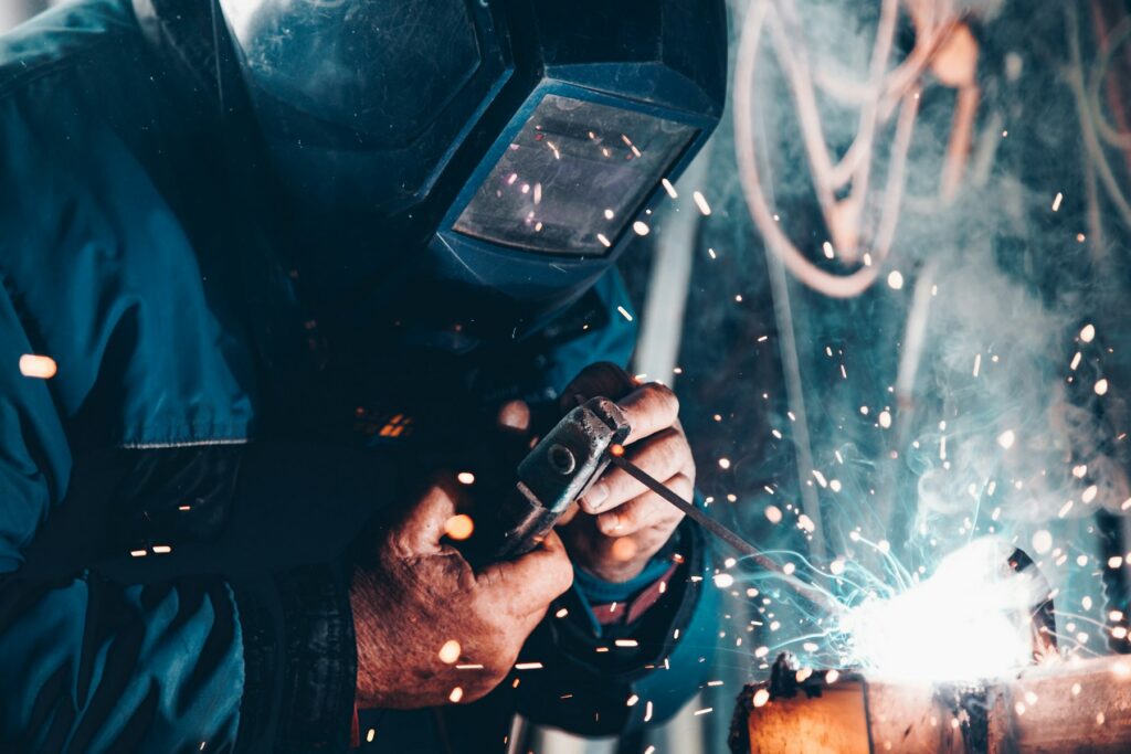 Welder at work in the RedLine Welding fabrication shop