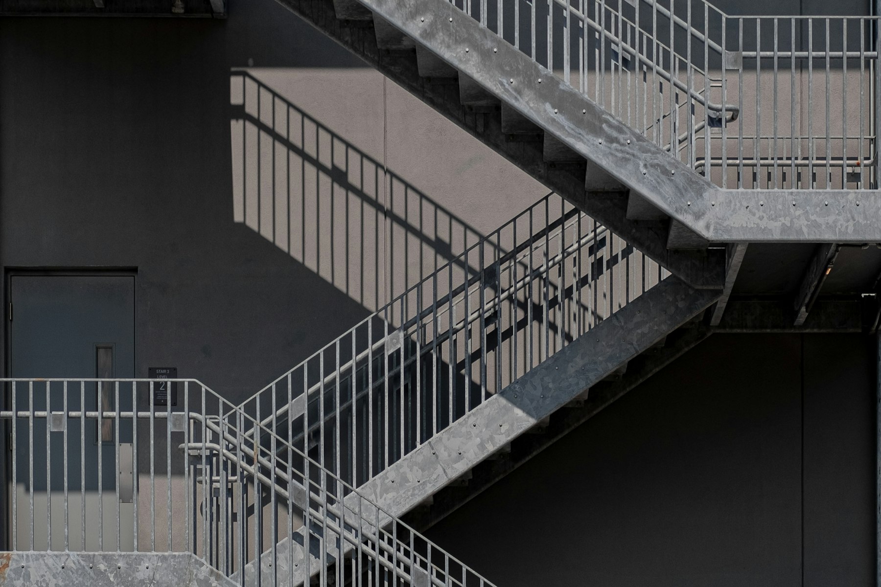 Industrial steel staircase with welded handrails