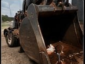 Excavator bucket repaired by on-site welding