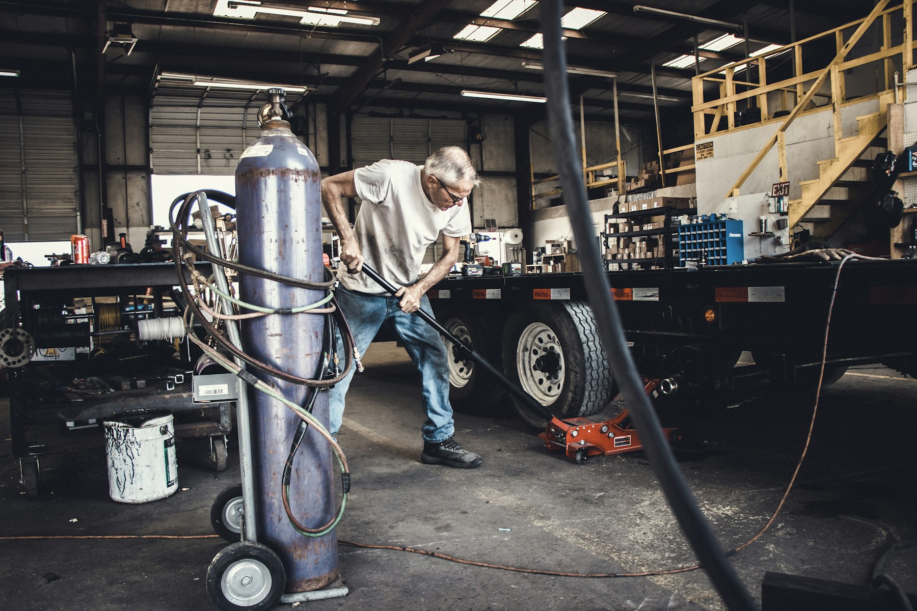 Mobile welding rig with gas bottles set up on a job site